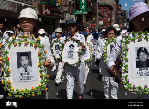 Members of Falun Dafa (Falun Gong) from around the world parade through the streets of Chinatown ...