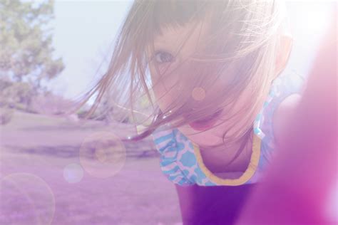 Girl's in Yellow and Blue Floral Shirt Taking Photo · Free Stock Photo