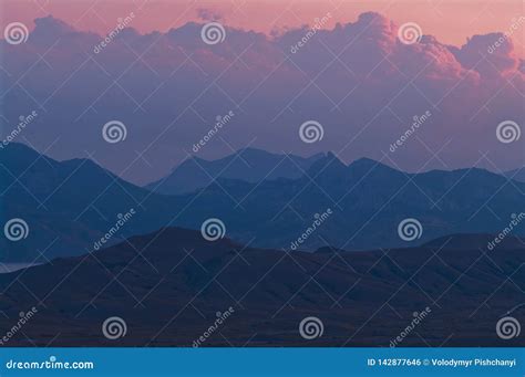 Purple Sunset in the Mountains. Evening Landscape in a Hilly Area with Purple Clouds Stock Photo ...