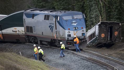 Amtrak train derails, dangles over interstate in Washington state