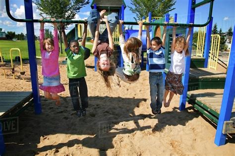 Group Of Children Playing In A Park - Stock Photo - Dissolve