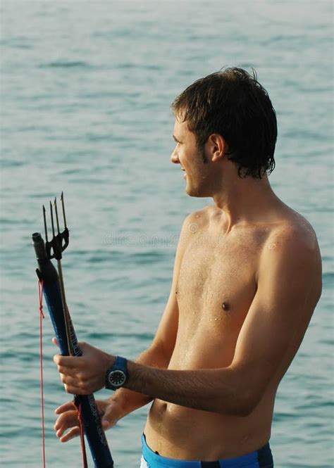 1+ Man holding fishing harpoon Free Stock Photos - StockFreeImages