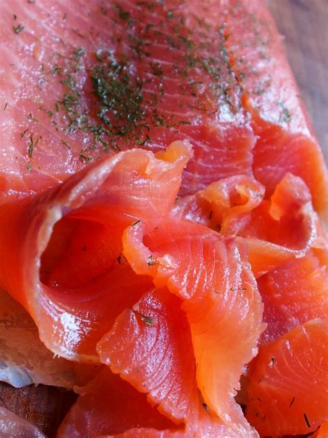 Beautifully colored smoked salmon lox, just sitting there waiting for the perfect bagel and ...