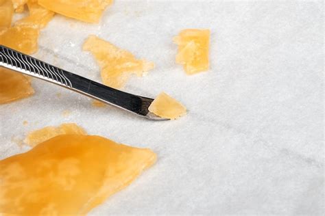 Premium Photo | Yellow orange cannabis concentrate wax close up high thc dab resin