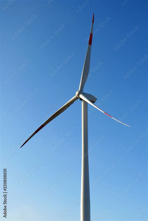 Wind turbines producing clean renewable energy Stock Photo | Adobe Stock