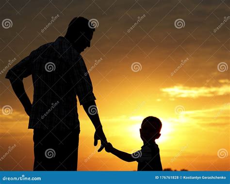 Silhouette of Father and Son on Sunset Stock Photo - Image of ...