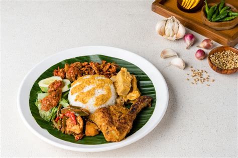 Premium Photo | Nasi Padang with chicken rendang is an Indonesian food ...