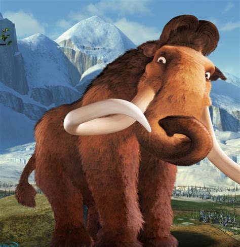 the wooly mammoth is standing in front of some snowy mountains and snow ...