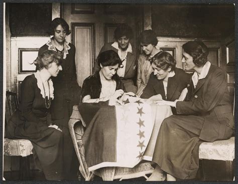 Alice Paul sews a star onto the NWP Ratification Flag, representing another state's ratification ...