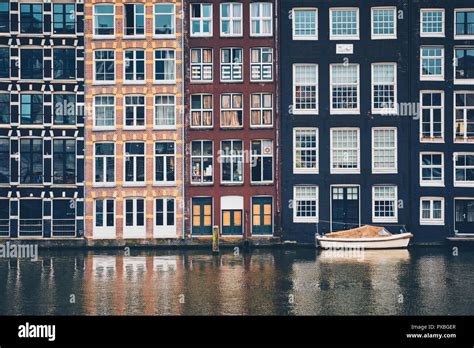 Amsterdam canal Damrak with houses, Netherlands Stock Photo - Alamy