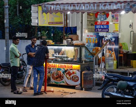 Men standing in front of a street food shop in Trichy, Tamil Nadu ...