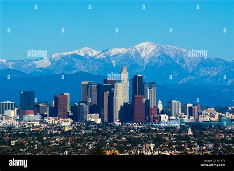 Snow covered San Gabriel Mountains behind downtown Los Angeles skyline ...