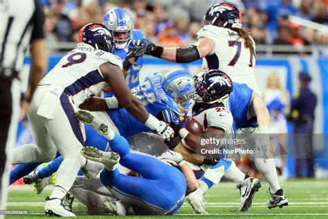 Denver Broncos running back Samaje Perine is tackled by Detroit Lions... News Photo - Getty Images