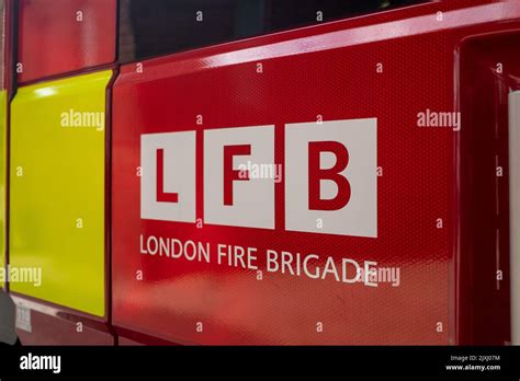 London- August 2022: London Fire Brigade logo on the side of a fire engine Stock Photo - Alamy