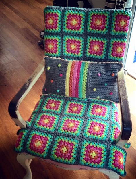 a crocheted chair sitting on top of a hard wood floor