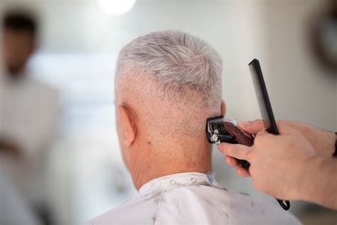 Person Using Hair Razor on Man's Hair · Free Stock Photo