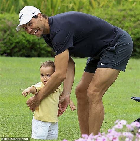 Like father, like son! A beaming Rafael Nadal gives his baby boy Rafa Junior a tennis racquet ...