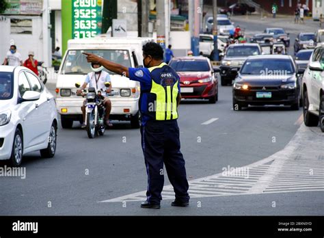 Antipolo City, Philippines - June 1, 2020: Traffic officers direct and ...