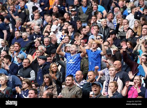 Millwall fans show their support in the stands Stock Photo - Alamy