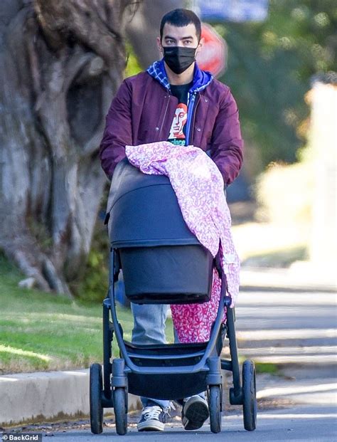 Joe Jonas spends some quality time with his baby daughter Willa as he takes her for a walk in LA ...