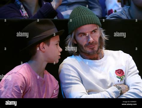 Romeo Beckham and David Beckham in the crowd during the Men's Single Final during day eight of ...