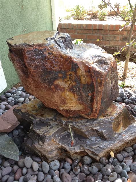 a large rock sitting on top of a pile of rocks