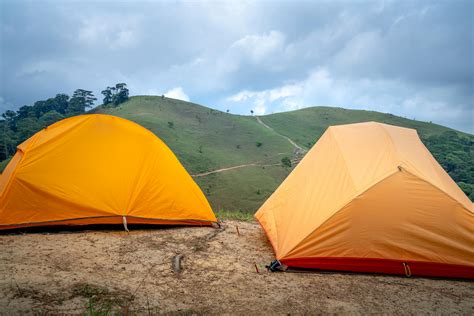 Bright camping tents on top of hill on overcast weather · Free Stock Photo