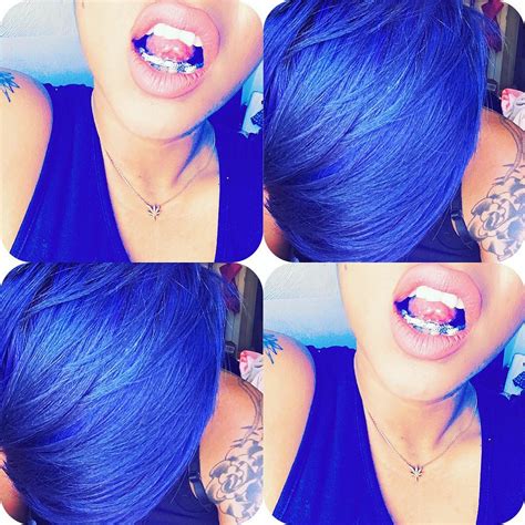 Skin tatted with the blue hair and gold teeth. | jennifer L | Flickr