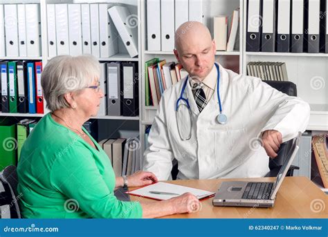 Doctor in Interview with a a Female Senior Stock Image - Image of coat, explain: 62340247