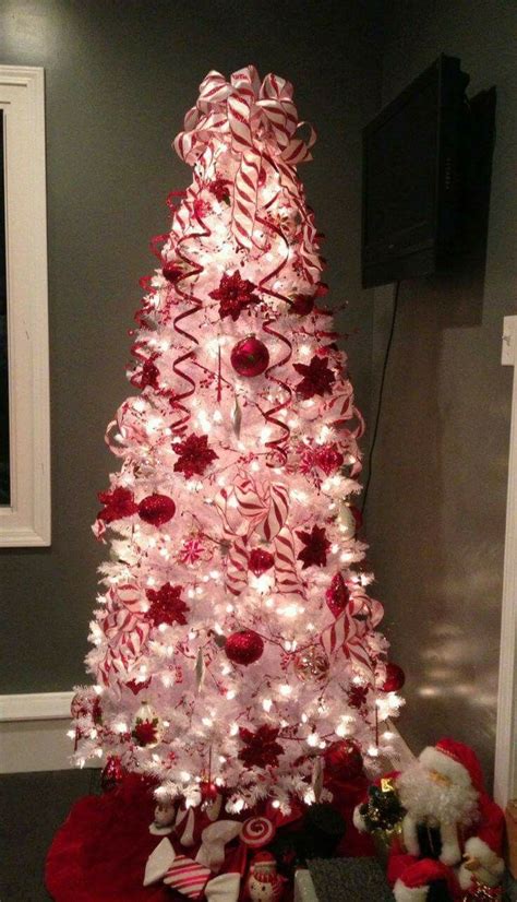 a white christmas tree decorated with candy canes