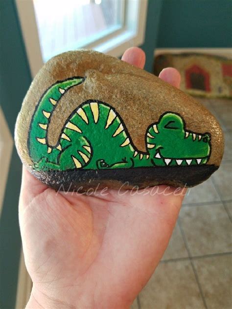 Sleepy dinosaur #paintedrocks #kindnessrocks | Painted rocks, Rock painting designs, Painted ...