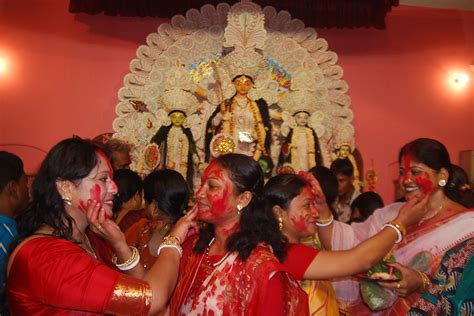 Bengali women participate in Sindur Khela at Durga Mandhir on the last day of Durga puja ...