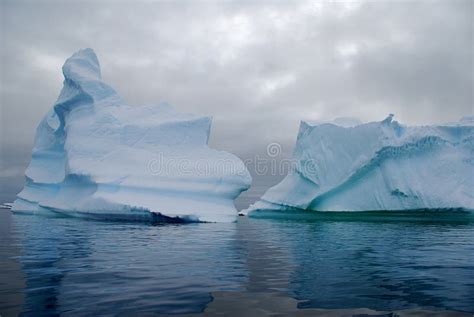 Two antarctic icebergs stock photo. Image of cold, iceberg - 14179296