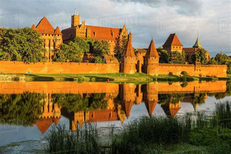 Malbork Castle at sunset, UNESCO World Heritage Site, Malbork, Poland ...