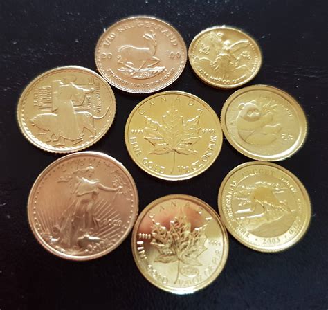 A collection of very small gold coins from around the world. 1/20 and 1 ...