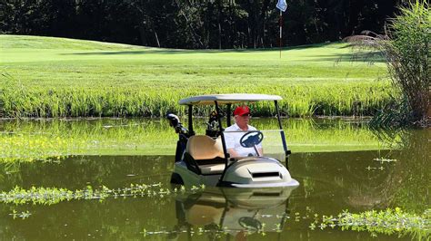 Despondent Trump Drives Golf Cart Into Water Hazard