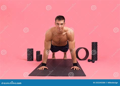 A Man Shows How To Do a Plank, Techniques, Variations. Athlete Pushing Up from the Floor. Planks ...