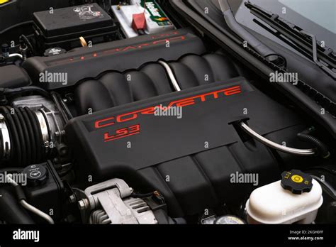 A Corvette C6 Engine bay, engine cover in matte black with red lettering Stock Photo - Alamy