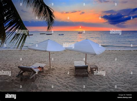 Sunset over Madagascar Nosy be beach with sunlounger Stock Photo - Alamy