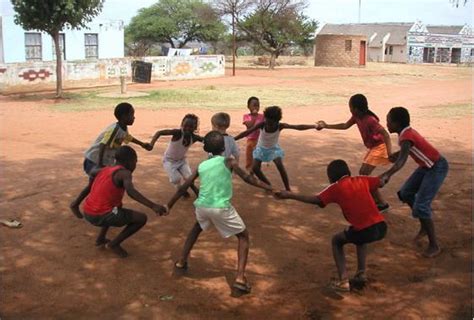 Kids playing in a circle – Paediatric Society of Ghana