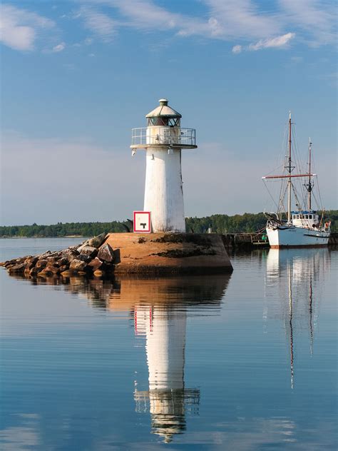 12 year of photos of the lighthouse in Hjo harbor and the lake Vättern ...