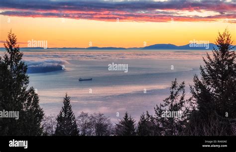 Burrard Inlet Sunset. Scenic view of this British Columbia waterway and the Strait of Georgia ...