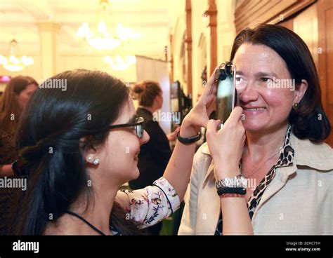 EDITORIAL USE ONLY Catherine West MP, Hornsey and Wood Green, has her eyesight tested by Priya ...