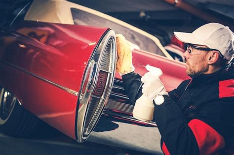 Premium Photo | Man cleaning car headlights