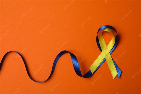 Premium Photo | Down syndrome awareness ribbons on orange