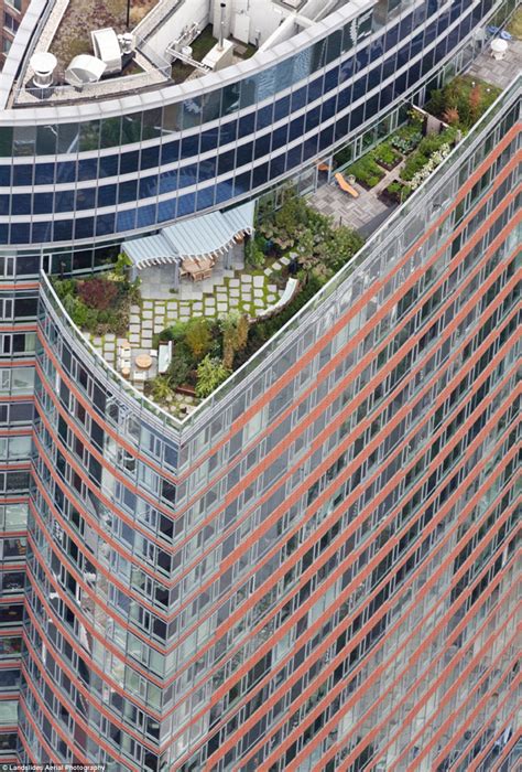New York's secret skyline: Amazing aerial shots give rare glimpse into a hidden rooftop world ...