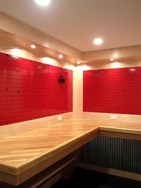 A REALLY nice workbench with red metal pegboard panels from Wall Control. | Metal pegboard ...