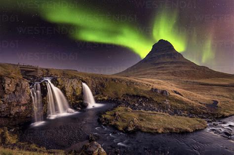 Aurora Borealis (Northern Lights) over Kirkjufell Mountian with a small ...