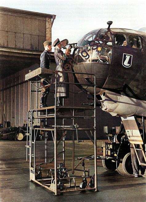 Reich propaganda personnel filming in front of the cockpit of a Heinkel "He-177". Under the cab ...