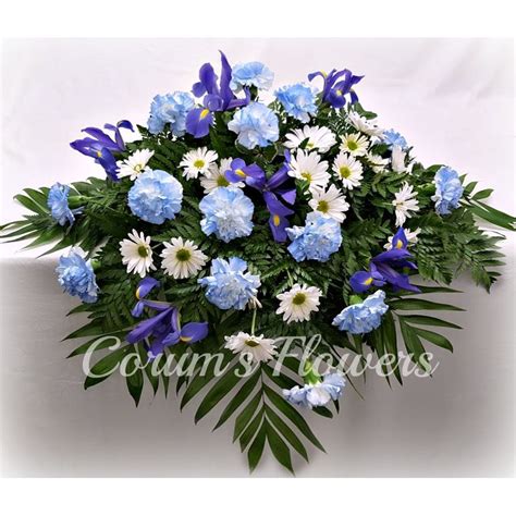 True Blue Casket Spray Corum's Flowers & Gifts, serving Council Bluffs & Omaha since 1910